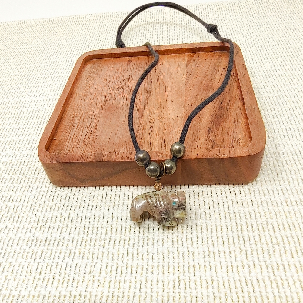 Simple black cord necklace with carved bear pendant